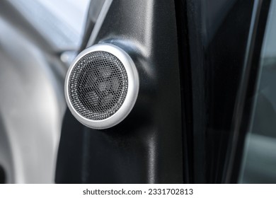 Close up tweeter speaker of a car with installed in a car door panel,Automotive part concept, with space for text.