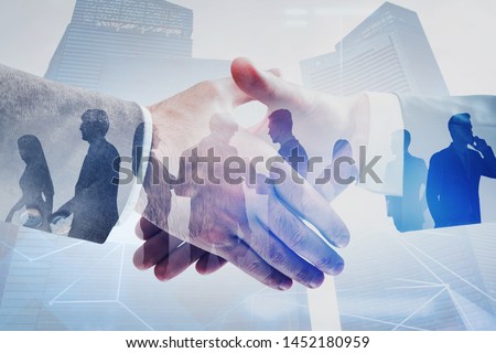 Close up of two businessmen shaking hands in modern city with double exposure of business people and network interface. Concept of connection and partnership. Toned image