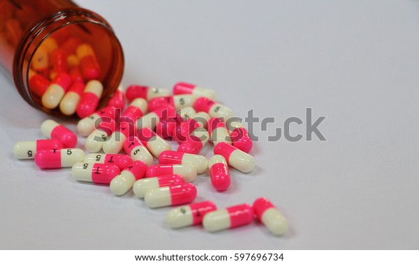 Close Two Color Pinkwhite Capsules Brown Stock Photo Edit Now 597696734