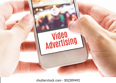 Close Up Two Hand Holding Mobile With Video Advertising Word, Digital Business Concept.