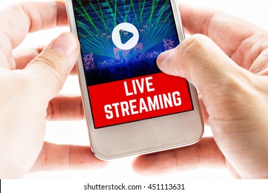 Close Up Two Hand Holding Mobile Phone With Live Streaming Word And Concert Event, Digital Marketing Concept.