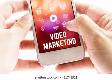 Close Up Two Hand Holding Mobile Phone With Video Marketing Word And Icons, Online Digital Marketing Concept.