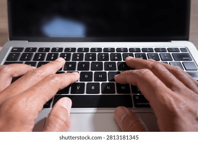 Close Up of Two Hands Typing on Laptop Keyboard for Blog Content Creation