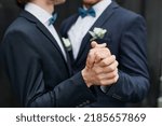 Close up of two men dancing together during wedding ceremony, same sex marriage