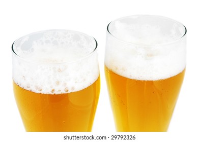 close up of two pints of beer