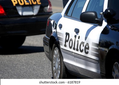 Close Up Of Two Police Cars Parked