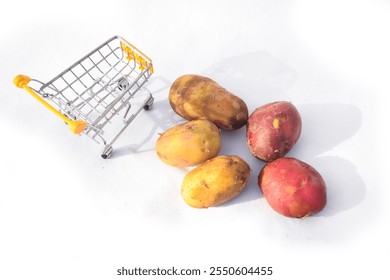 Close up of two red potatoes against white background, Above view of colorful fresh little potatoes spilling from burlap bag on a rustic,Raw red potatoes in burlap bag isolated on white background - Powered by Shutterstock