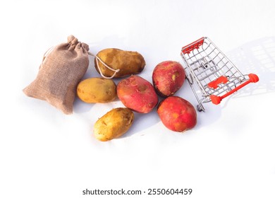 Close up of two red potatoes against white background, Above view of colorful fresh little potatoes spilling from burlap bag on a rustic,Raw red potatoes in burlap bag isolated on white background - Powered by Shutterstock