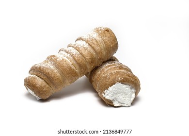 Close up of two stacked foam rolls as a traditional sweet Austrian dessert made of puff pastry with sugar whipped cream filling on white background