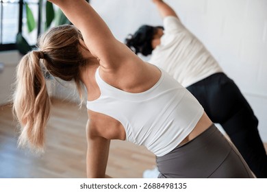 Close up of two womens back while stretching