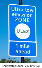 Close up of ULTRA LOW EMISSION ZONE sign against a clear blue sky. - Shutterstock ID 2194199493