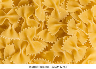 Close up of uncooked farfalle pasta as a background - Powered by Shutterstock