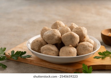 Close up Uncooked Thai Pork meatballs on white plate.