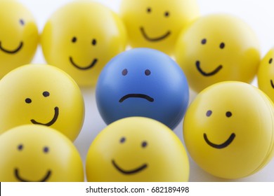 Close Up Of Unhappy And Happy Smileys