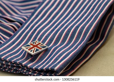 Close Up Of Union Jack Cufflink And Double Cuff Stripy Business Shirt