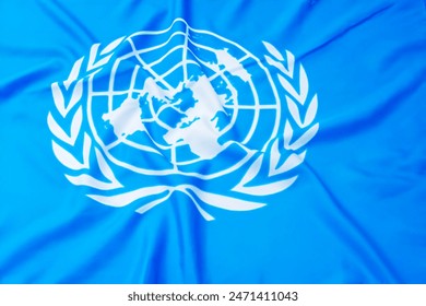 Close up of United Nations flag. The United Nations (UN) is an international organization whose stated aims are facilitating cooperation in international law, international security,