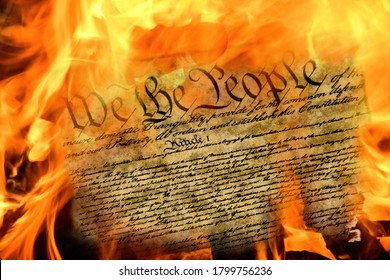 close up of United States constitution document burning in flames