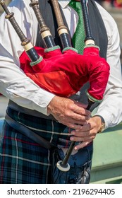 Close Up Of An Unrecognizable Bagpipe Player