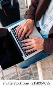 Close up of an unrecognizable business man using laptop.
