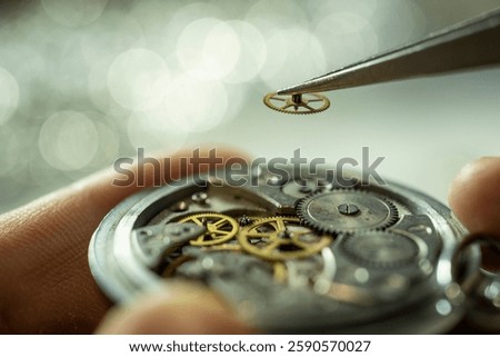 Close up of unrecognizable factory worker assembling intricate mechanical watch, copy space