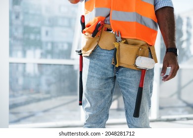 Close Up Of Unrecognizable Man Foreman In Workwear On Construction Site