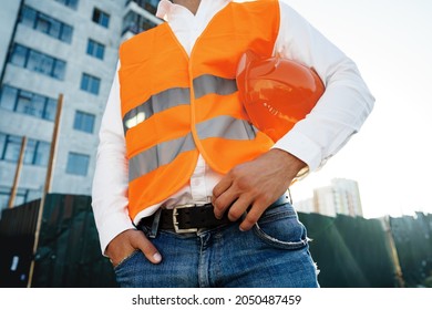 Close Up Of Unrecognizable Man Foreman In Workwear On Construction Site