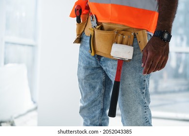 Close Up Of Unrecognizable Man Foreman In Workwear On Construction Site