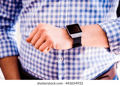 Close up of unrecognizable man using smart watch