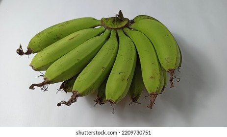 Close Up Of Unripe Green Banana On White Background