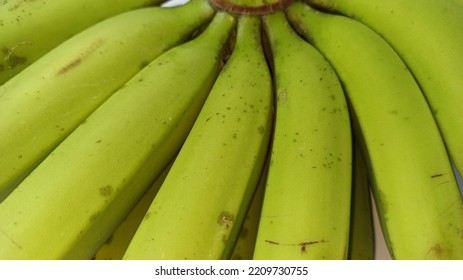 Close Up Of Unripe Green Banana On White Background