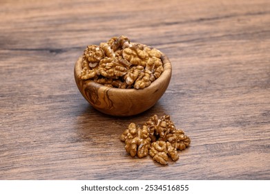 Close up of unshelled brown walnuts in a bowl - Powered by Shutterstock