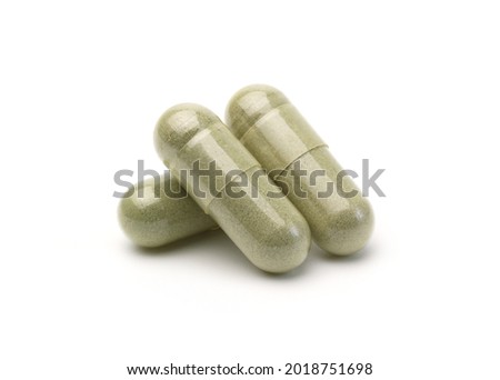 Close up, Andrographis paniculata capsule or herbal capsules isolated on white background, Used as a herbal remedy for fever.