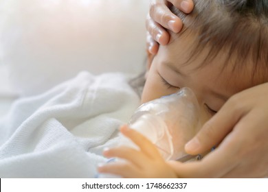 Close Up. Asian Baby Girl Breathing Treatment With Mother Take Care, At Room Hospital. Health Care Kid Concept.