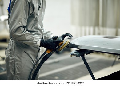 close up, Auto mechanic grinds car part for painting. Car body work auto repair paint after accident - Powered by Shutterstock