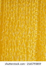 close up, background, texture, large vertical banner. heterogeneous surface structure bright saturated yellow sponge for washing dishes, kitchen, bath. full depth of field. high resolution photo - Shutterstock ID 2165793859