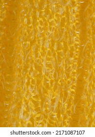 close up, background, texture, large vertical banner. heterogeneous surface structure bright saturated yellow sponge for washing dishes, kitchen, bath. full depth of field. high resolution photo - Shutterstock ID 2171087107