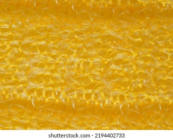 close up, background, texture, large horizontal banner. heterogeneous surface structure bright saturated yellow sponge for washing dishes, kitchen, bath. full depth of field. high resolution photo - Shutterstock ID 2194402733