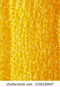 close up, background, texture, large vertical banner. heterogeneous surface structure bright saturated yellow sponge for washing dishes, kitchen, bath. full depth of field. high resolution photo - Shutterstock ID 2196130947