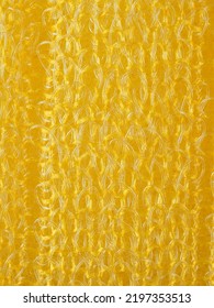 close up, background, texture, large vertical banner. heterogeneous surface structure bright saturated yellow sponge for washing dishes, kitchen, bath. full depth of field. high resolution photo - Shutterstock ID 2197353513