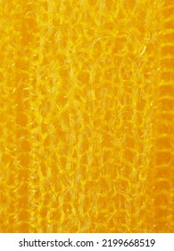 close up, background, texture, large vertical banner. heterogeneous surface structure bright saturated yellow sponge for washing dishes, kitchen, bath. full depth of field. high resolution photo - Shutterstock ID 2199668519