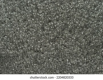 close up, background, texture, large long horizontal banner. surface structure black expanded polyethylene, EPE, padding cushioning material for packages. full depth of field. high resolution photo - Shutterstock ID 2204820333
