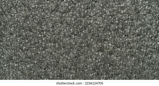 close up, background, texture, large long horizontal banner. surface structure black expanded polyethylene, EPE, padding cushioning material for packages. full depth of field. high resolution photo - Shutterstock ID 2236124705