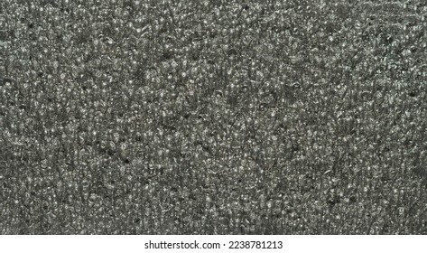 close up, background, texture, large long vertical banner. surface structure black expanded polyethylene, EPE, padding cushioning material for packages. full depth of field. high resolution photo - Shutterstock ID 2238781213