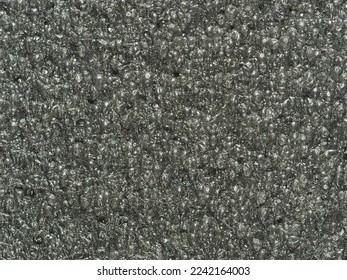 close up, background, texture, large vertical banner. surface structure black expanded polyethylene, EPE, padding cushioning material for packages. full depth of field. high resolution photo - Shutterstock ID 2242164003
