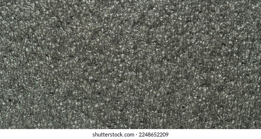 close up, background, texture, large long vertical banner. surface structure black expanded polyethylene, EPE, padding cushioning material for packages. full depth of field. high resolution photo - Shutterstock ID 2248652209