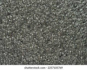 close up, background, texture, large vertical banner. surface structure black expanded polyethylene, EPE, padding cushioning material for packages. full depth of field. high resolution photo - Shutterstock ID 2257105769
