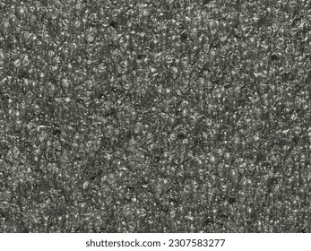 close up, background, texture, large vertical banner. surface structure black expanded polyethylene, EPE, padding cushioning material for packages. full depth of field. high resolution photo - Shutterstock ID 2307583277