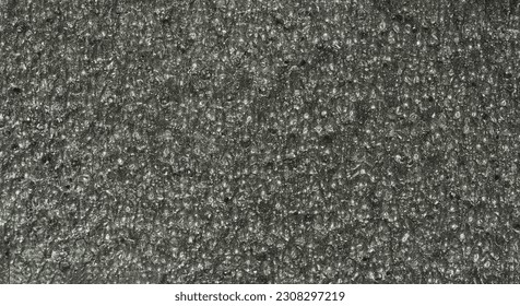 close up, background, texture, large long horizontal banner. surface structure black expanded polyethylene, EPE, padding cushioning material for packages. full depth of field. high resolution photo - Shutterstock ID 2308297219