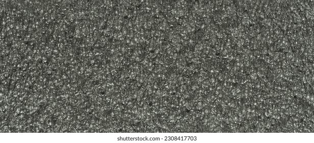 close up, background, texture, large long horizontal banner. surface structure black expanded polyethylene, EPE, padding cushioning material for packages. full depth of field. high resolution photo - Shutterstock ID 2308417703