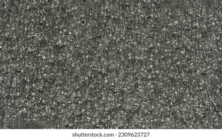 close up, background, texture, large long horizontal banner. surface structure black expanded polyethylene, EPE, padding cushioning material for packages. full depth of field. high resolution photo - Shutterstock ID 2309623727